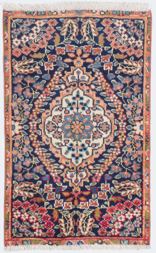 floral Persian vintage bathmat with lots of roses and light colors of orange, pink and blue on the background